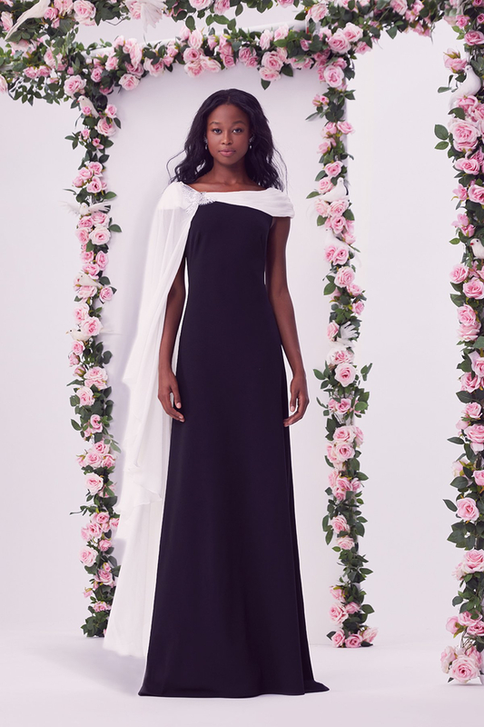 IVORY/BLACK TEXTURED CREPE AND CRINKLE CHIFFON CAP SLEEVE GOWN WITH ONE SHOULDER CAPE SLEEVE AND CRYSTAL-EMBELLISHED DOVE APPLIQUÉ