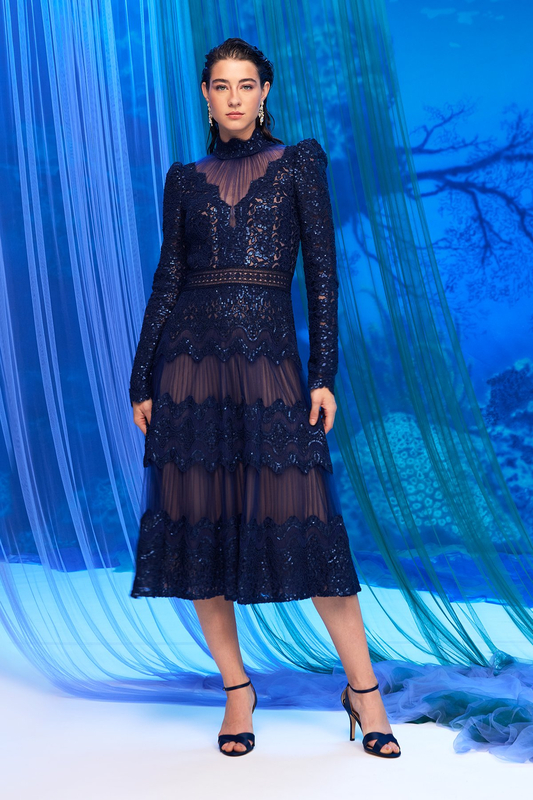 ROYAL NAVY NUDE PAILLETTE-EMBROIDERED TULLE MOCK NECK SUNBURST ILLUSION PUFF SHOULDER LONG SLEEVE TEA-LENGTH DRESS WITH TIERED SKIRT